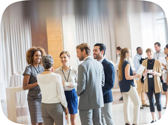 Professionals networking at an event